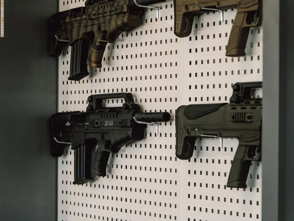 Firearms arranged on a retail display wall