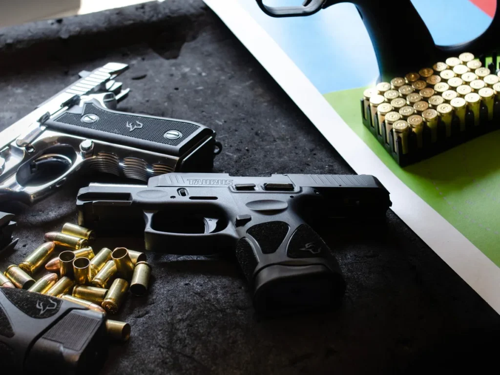 Modern handguns, magazines, and ammunition on display