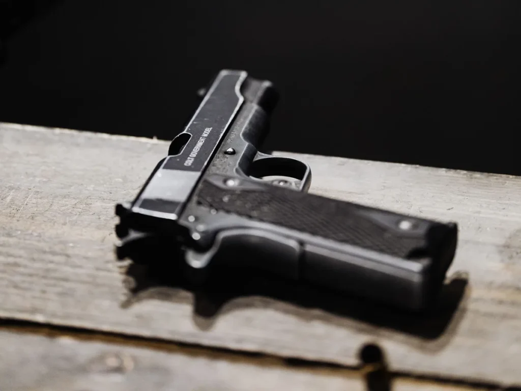 Detailed handgun still life on a wooden surface