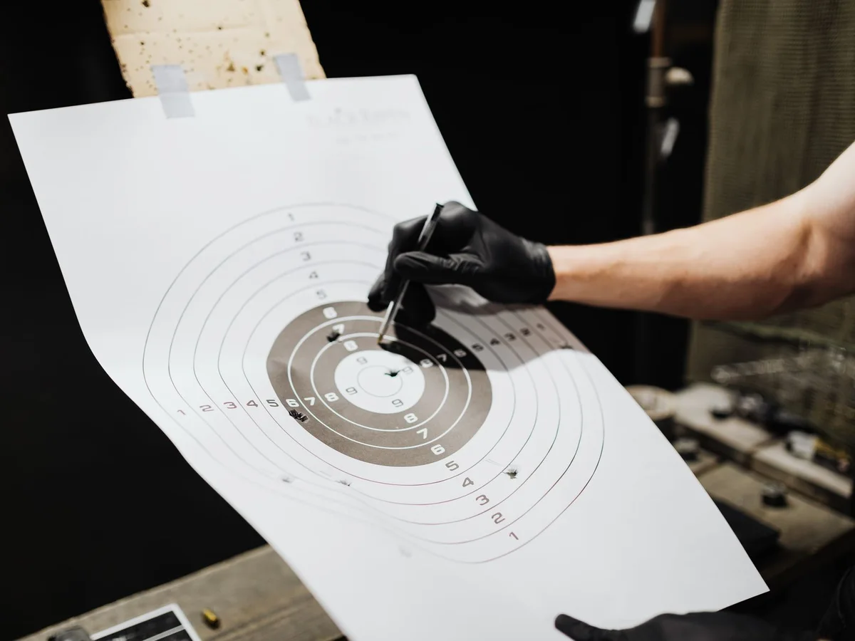 Close-up of a marked paper target at a shooting range