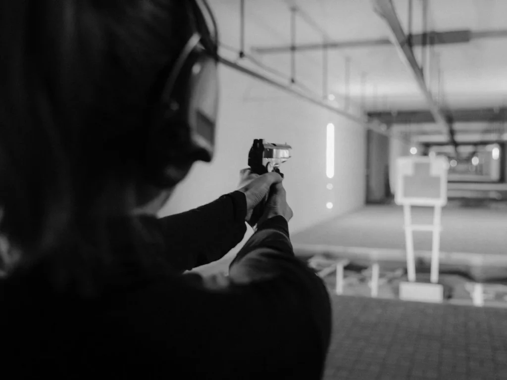 Shooter wearing hearing protection at an indoor handgun range