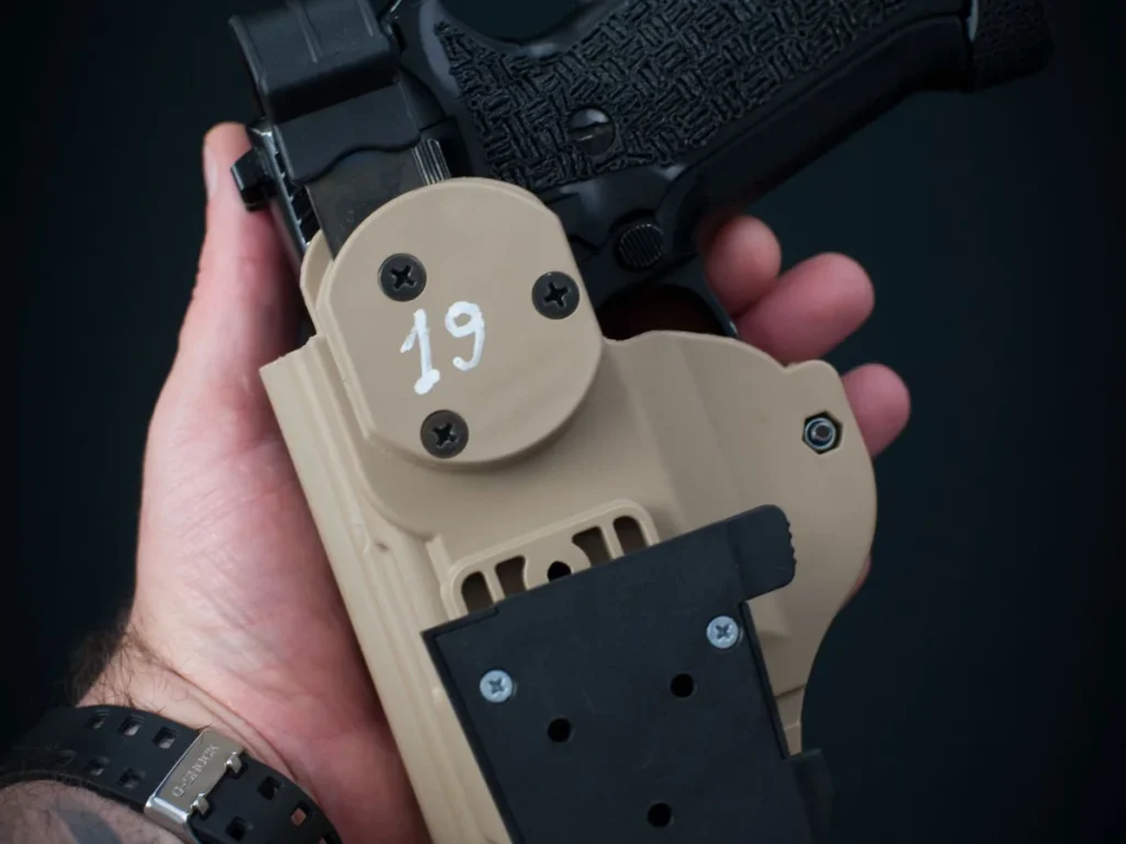 Close-up of a handgun and molded tactical holster