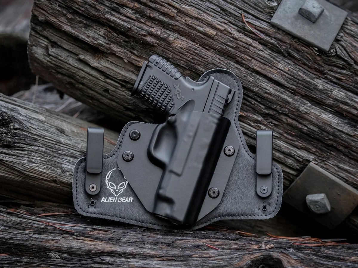 Handgun carried in a leather belt holster